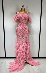 Elegant pink mesh evening gown with soft flowing fabric and feminine silhouette