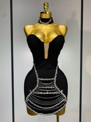 Jamilah strapless mini bodycon dress with rhinestone chain detailing and backless design for women’s birthday or evening parties.
