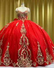 Royal red tulle ball gown with gold embellished bodice and large back bow