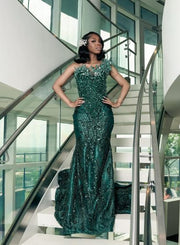 Green glitter beaded rhinestone mermaid prom dress with shimmering details.