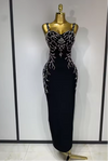 Sasha black bandage maxi dress with a deep V-neckline and hand-sewn black beadwork in a bodycon long silhouette.
