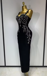 Sasha black bandage maxi dress with a deep V-neckline and hand-sewn black beadwork in a bodycon long silhouette.