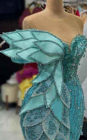 Azure Leaf Sculptural Mermaid Gown With Iridescent Beading And Tiered Petal Bodice