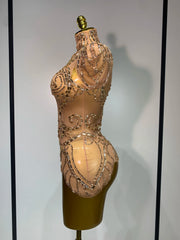 Denise sparkly rhinestone mesh bodysuit with sheer fabric and shimmering crystals.