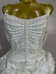 Kelsey white off-shoulder bandage mini dress with pearl chain accents and three-dimensional floral embellishments