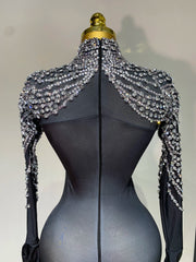 Audre luxury rhinestone stretch jumpsuit with shimmering rhinestones and fitted silhouette.