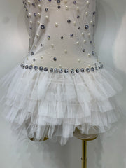 Jem white mesh bodysuit featuring sparkling diamond-like embellishments for a glamorous party outfit