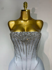 Jasmine strapless grey bandage dress with beading details and backless design for evening parties.