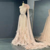 Blush pink luxury gown with feathers and cape