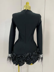 Nicole shiny diamond feather long-sleeve bodycon dress with sparkling crystals and elegant feather cuffs.
