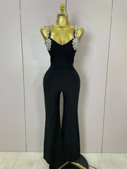 Kaylani wearing a shining diamonds V neck sleeveless jumpsuit with sparkling rhinestone details.