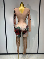 Khai wearing a rose print sparkly rhinestone jumpsuit for a luxury prom look.