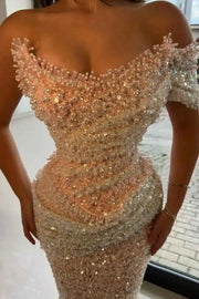 Elegant sequin mermaid prom dress with floor-length design and sparkling details.