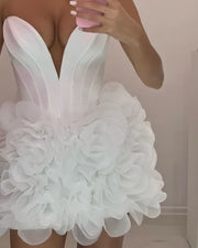 Mannequin Wearing a Stylish White Ruffled Tulle Corset Birthday Dress with Layered Skirt and Structured Bodice, Styled for Luxe Celebrations