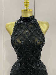 Journee wearing a luxury sparkly black diamond mesh see through jumpsuit.