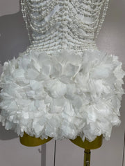 Kelsey white off-shoulder bandage mini dress with pearl chain accents and three-dimensional floral embellishments