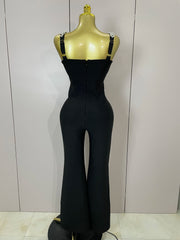 Kaylani wearing a shining diamonds V neck sleeveless jumpsuit with sparkling rhinestone details.