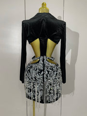 Naomi black hollow-out mini dress with diamond accents and tassels for women’s evening parties, birthdays, or stage events.