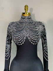 Audre luxury rhinestone stretch jumpsuit with shimmering rhinestones and fitted silhouette.