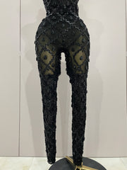 Journee wearing a luxury sparkly black diamond mesh see through jumpsuit.