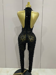 Journee wearing a luxury sparkly black diamond mesh see through jumpsuit.