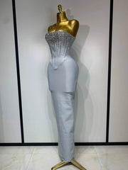 Jasmine strapless grey bandage dress with beading details and backless design for evening parties.