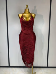 Cloe sleeveless backless bandage midi dress featuring decorative tassel details and a fitted bodycon silhouette