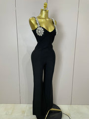 Kaylani wearing a shining diamonds V neck sleeveless jumpsuit with sparkling rhinestone details.