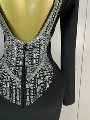 Maggie black rhinestone bandage maxi dress with long sleeves, a backless design, and a figure-hugging bodycon silhouette