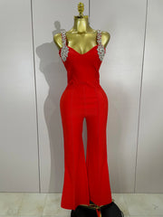 Kaylani wearing a shining diamonds V neck sleeveless jumpsuit with sparkling rhinestone details.