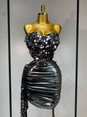 Mannequin Wearing a Sparkly Sequins Two Piece Set Birthday Outfit with Glittering Crop Top and Matching Mini Skirt, Styled for Luxe Celebrations
