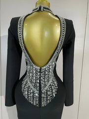 Maggie black rhinestone bandage maxi dress with long sleeves, a backless design, and a figure-hugging bodycon silhouette