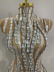 Shine in the Lani rhinestone chain transparent bodysuit. Sexy sleeveless mesh outfit for stage performances, parties, birthdays, and nightlife.