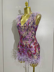 Celebrate in style with the Karina rhinestone feather embroidered bodycon dress. Elegant party dress for birthdays, cocktails, and special events.