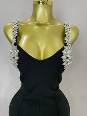 Kaylani wearing a shining diamonds V neck sleeveless jumpsuit with sparkling rhinestone details.