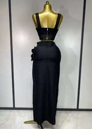 Black and red floral bandage two piece outfit with fitted top and skirt.