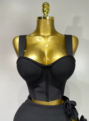 Black and red floral bandage two piece outfit with fitted top and skirt.