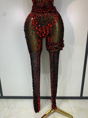 Turn heads in the Amanda backless red rhinestone black mesh jumpsuit. Sparkly bodycon outfit for stage performances, parties, and birthdays.