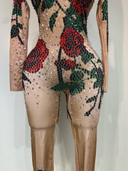 Khai wearing a rose print sparkly rhinestone jumpsuit for a luxury prom look.