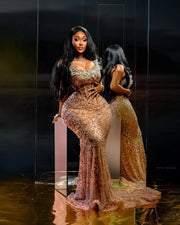 Golden beaded prom dress with luxury detailing and fitted silhouette.