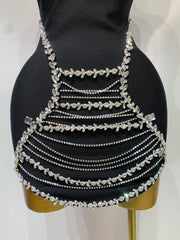Jamilah strapless mini bodycon dress with rhinestone chain detailing and backless design for women’s birthday or evening parties.