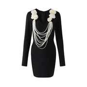 Paulina black long sleeve u neck bodycon mini bandage dress with white flower pearl chain