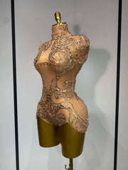 Denise sparkly rhinestone mesh bodysuit with sheer fabric and shimmering crystals.