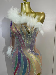 Turn heads in the Wendy one-shoulder rhinestone feather dress. Sexy sheer bodycon party dress for birthdays, cocktails, and evening events.