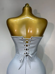 Jasmine strapless grey bandage dress with beading details and backless design for evening parties.