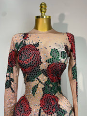 Khai wearing a rose print sparkly rhinestone jumpsuit for a luxury prom look.