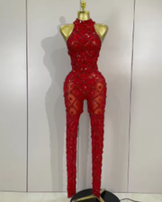 Teyah wearing a sparkly red diamonds mesh see through jumpsuit for a luxury prom look.