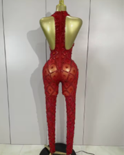 Teyah wearing a sparkly red diamonds mesh see through jumpsuit for a luxury prom look.