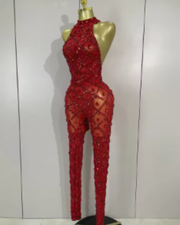 Teyah wearing a sparkly red diamonds mesh see through jumpsuit for a luxury prom look.