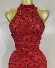 Teyah wearing a sparkly red diamonds mesh see through jumpsuit for a luxury prom look.